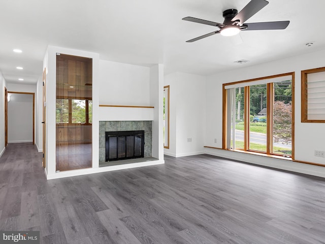 261 W Chestnut Hill Rd, Newark, DE 19713 - unfurnished living room with plenty of natural light, ceiling fan, wood finished floors, a tiled fireplace, and recessed lighting