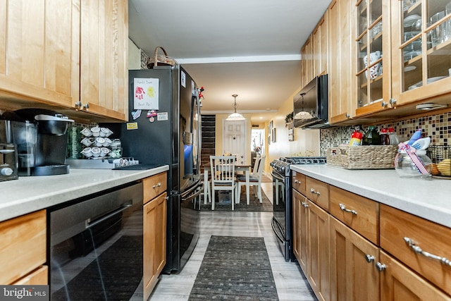 1512 S 2nd St, Philadelphia, PA 19147 - kitchen with black appliances, tasteful backsplash, light countertops, and light wood-style flooring