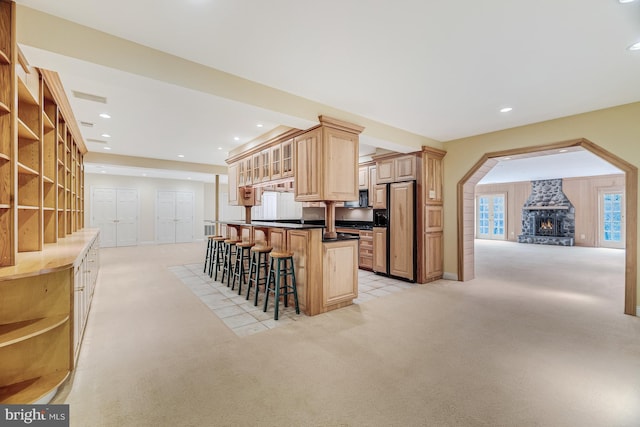 14000 Crossland Ln, Gaithersburg, MD 20878 - kitchen with high quality fridge, light colored carpet, open shelves, a kitchen bar, and recessed lighting