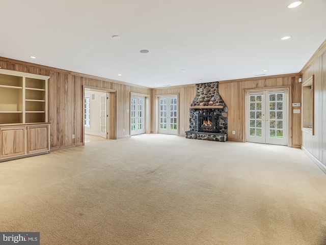 14000 Crossland Ln, Gaithersburg, MD 20878 - unfurnished living room with wood walls, ornamental molding, carpet, plenty of natural light, and recessed lighting
