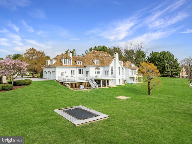 14000 Crossland Ln, Gaithersburg, MD 20878 - back of house with a chimney, a lawn, a deck, and stairs