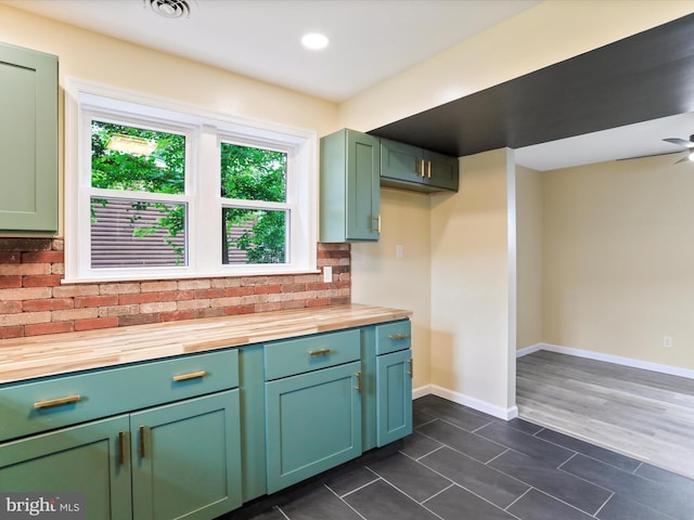 320 Valley View Ave, Keyser, WV 26726 - kitchen with wooden counters, dark tile patterned flooring, decorative backsplash, and green cabinets