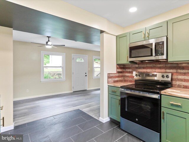 320 Valley View Ave, Keyser, WV 26726 - kitchen with green cabinets, stainless steel appliances, backsplash, ceiling fan, and wooden counters