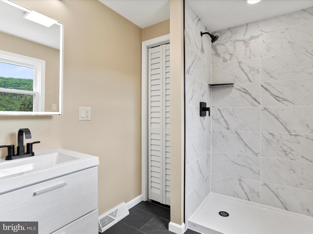 320 Valley View Ave, Keyser, WV 26726 - bathroom with vanity, a tile shower, a closet, and tile patterned flooring