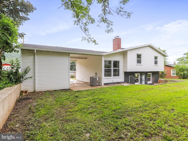 320 Valley View Ave, Keyser, WV 26726 - back of house with a patio, a lawn, a chimney, and a carport