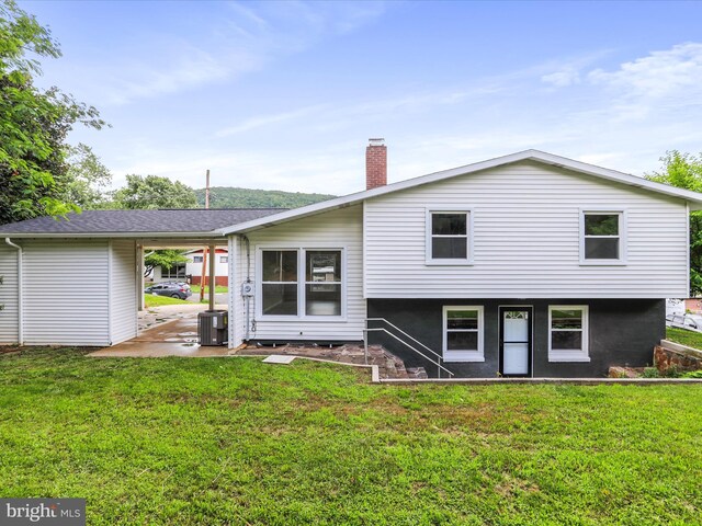 320 Valley View Ave, Keyser, WV 26726 - rear view of property featuring a yard, a chimney, a patio area, and an attached carport