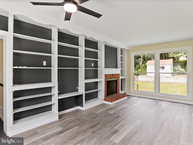 320 Valley View Ave, Keyser, WV 26726 - unfurnished living room with wood finished floors, ceiling fan, and a fireplace
