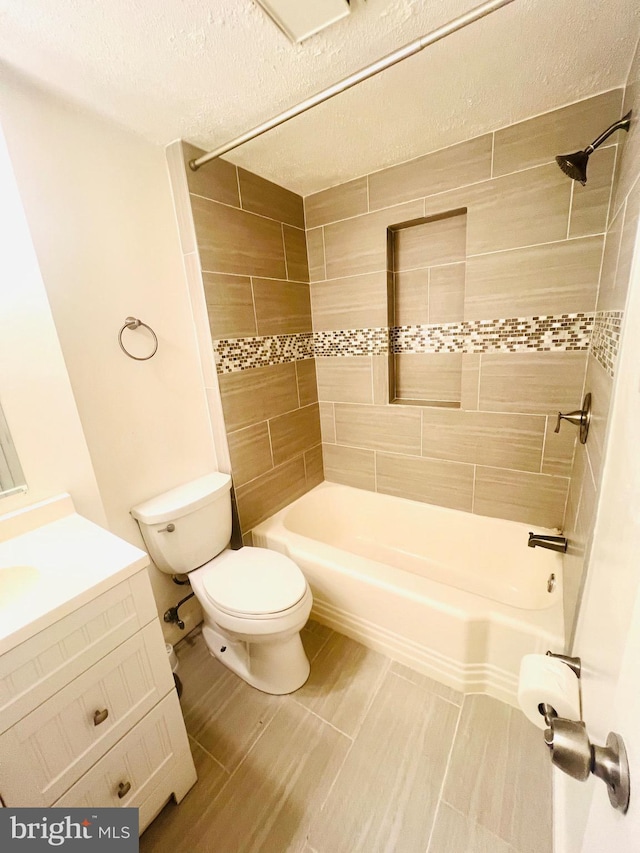 6011 State St, Cheverly, MD 20785 - bathroom featuring vanity, shower / tub combination, and a textured ceiling