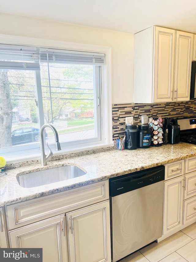 6011 State St, Cheverly, MD 20785 - kitchen featuring dishwasher, cream cabinets, and light stone countertops