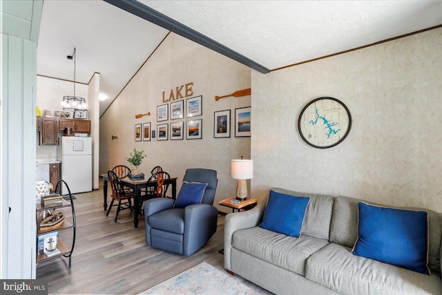 20160 Garrett Hwy Unit H708, Oakland, MD 21550 - living area featuring light wood-style flooring, ornamental molding, a textured wall, and a chandelier
