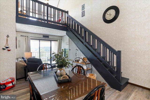 20160 Garrett Hwy Unit H708, Oakland, MD 21550 - dining area with stairway, wood finished floors, and a towering ceiling