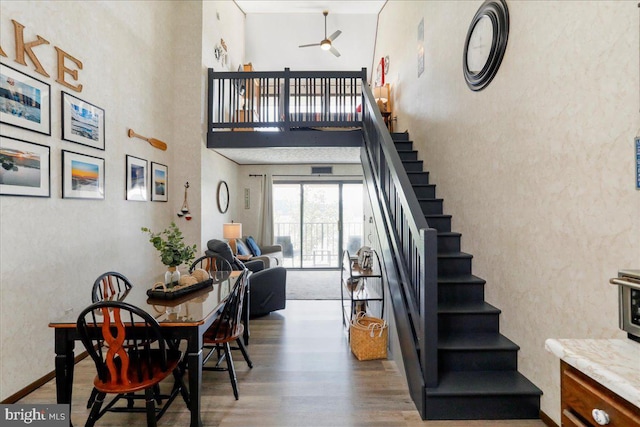 20160 Garrett Hwy Unit H708, Oakland, MD 21550 - dining room with ceiling fan, wood finished floors, stairs, and a towering ceiling