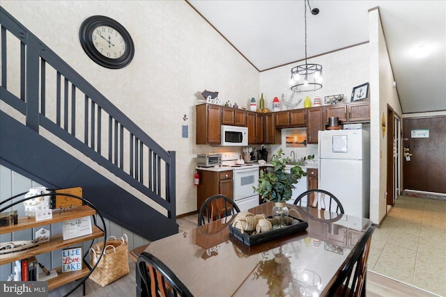 20160 Garrett Hwy Unit H708, Oakland, MD 21550 - dining space with high vaulted ceiling, stairs, and a chandelier