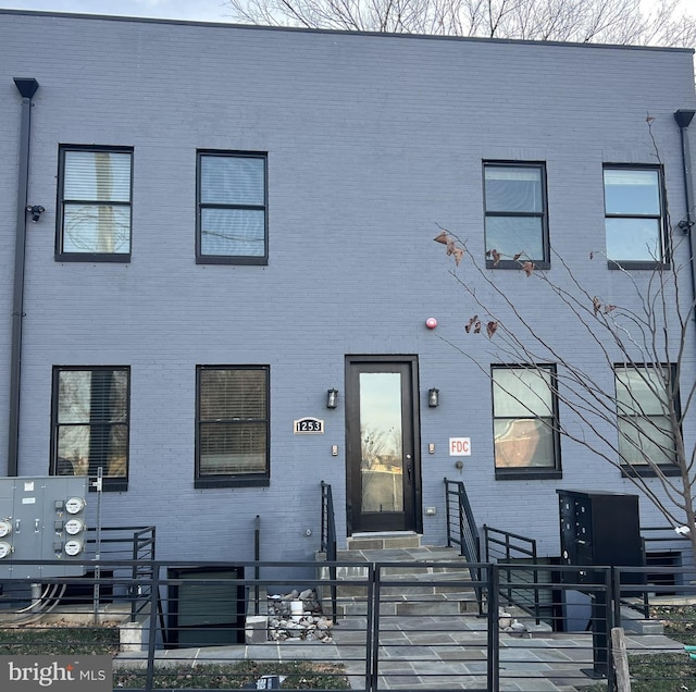 1253 Mount Olivet Rd NE Unit 3, Washington, DC 20002 - townhome / multi-family property with a fenced front yard and brick siding