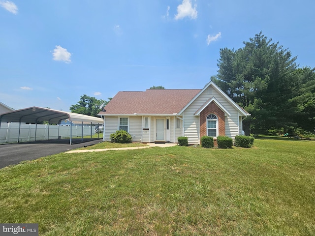 215 Maury Ave, Bowling Green, VA 22427 - ranch-style house with a detached carport, roof with shingles, and asphalt driveway