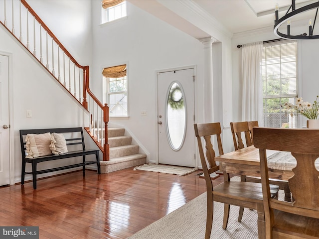 15164 Santander Dr, Gainesville, VA 20155 - entryway featuring hardwood / wood-style floors, stairway, crown molding, and a chandelier