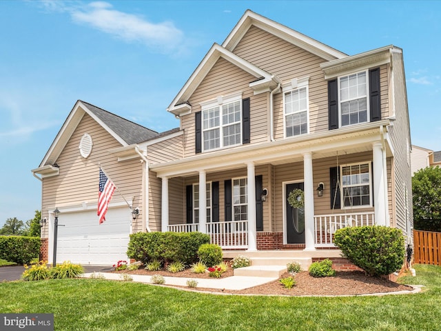 15164 Santander Dr, Gainesville, VA 20155 - traditional-style house with covered porch, asphalt driveway, and brick siding