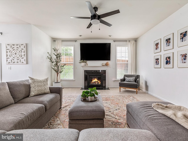 15164 Santander Dr, Gainesville, VA 20155 - living room with ceiling fan, a fireplace with flush hearth, healthy amount of natural light, and carpet flooring