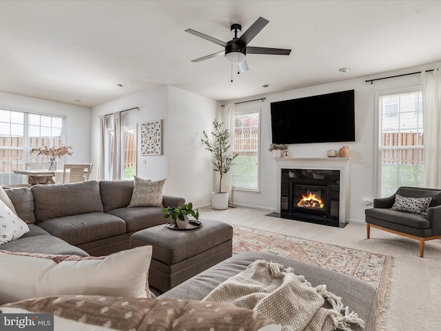 15164 Santander Dr, Gainesville, VA 20155 - carpeted living room with healthy amount of natural light, a fireplace with flush hearth, and ceiling fan