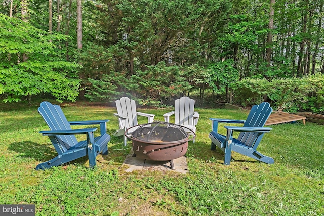 4 Bunkers Ct, Grasonville, MD 21638 - view of green lawn featuring a fire pit