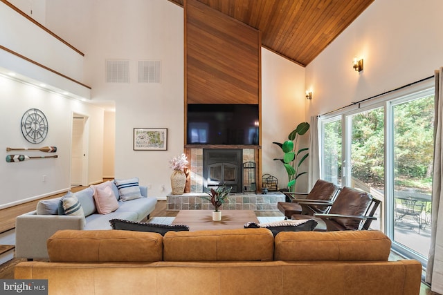 4 Bunkers Ct, Grasonville, MD 21638 - living room with high vaulted ceiling, wood ceiling, and a tile fireplace