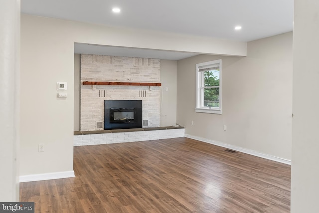 1557 Fairview Ave, Langhorne, PA 19047 - unfurnished living room with wood finished floors, a fireplace, and recessed lighting