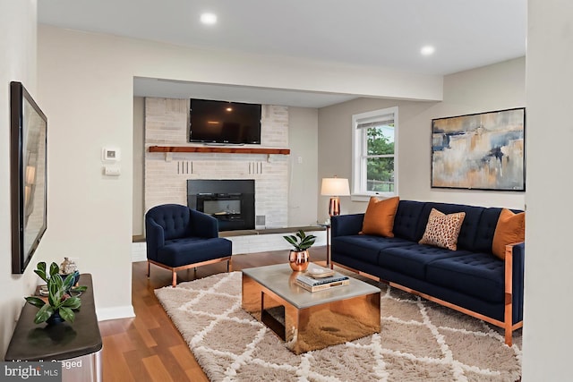 1557 Fairview Ave, Langhorne, PA 19047 - living room with wood finished floors, a brick fireplace, and recessed lighting