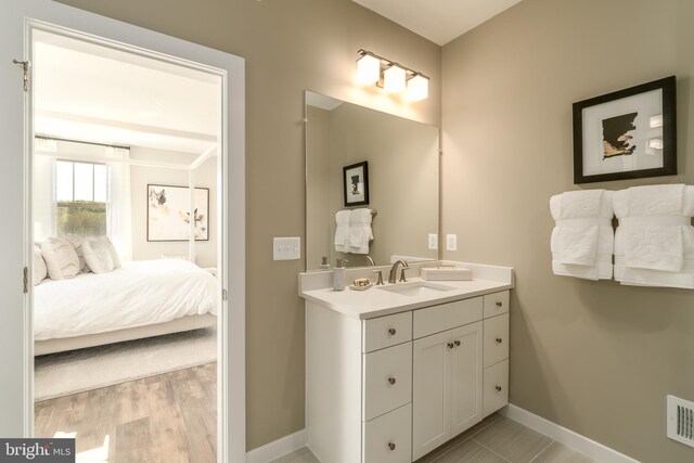 2112 Abboccato Ter SE, Leesburg, VA 20175 - ensuite bathroom featuring vanity and baseboards