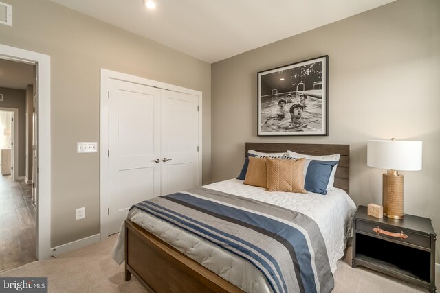2112 Abboccato Ter SE, Leesburg, VA 20175 - carpeted bedroom featuring a closet and baseboards