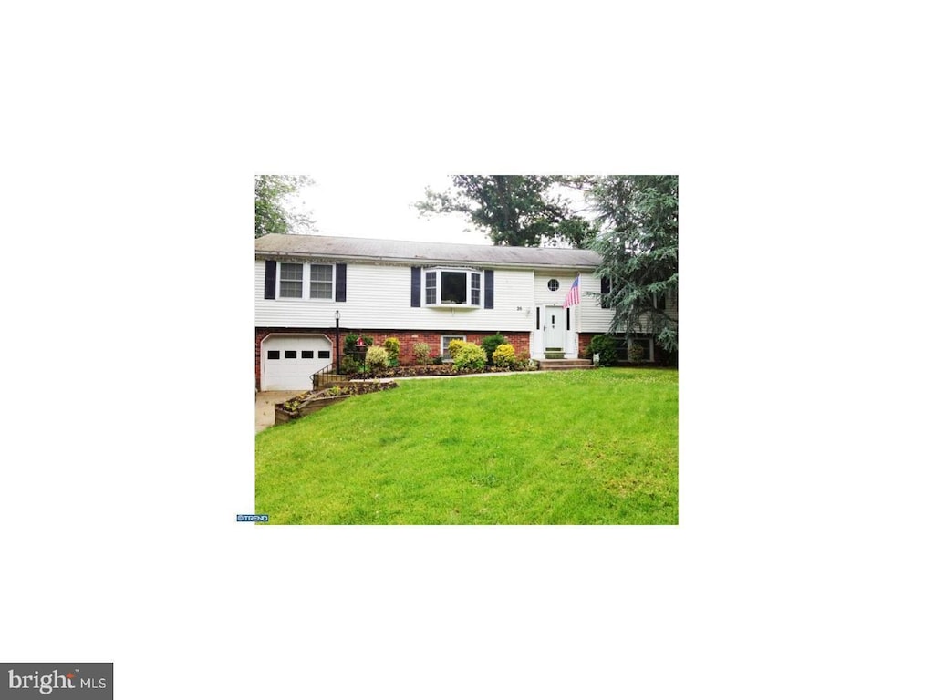 26 Tall Oaks Dr, Clementon, NJ 08021 - bi-level home with an attached garage, a front lawn, brick siding, and driveway