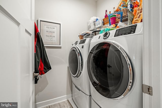 621 Thomas Penn Dr, West Grove, PA 19390 - laundry room featuring washing machine and dryer and light wood finished floors