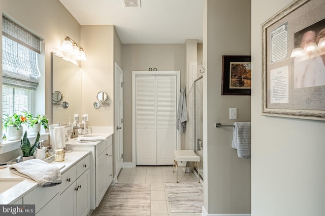621 Thomas Penn Dr, West Grove, PA 19390 - bathroom with a stall shower, vanity, tile patterned flooring, and a closet