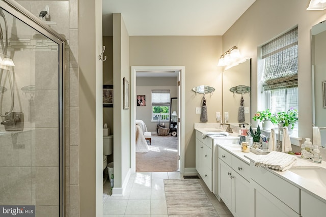 621 Thomas Penn Dr, West Grove, PA 19390 - ensuite bathroom featuring double vanity, a stall shower, and tile patterned floors