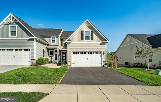621 Thomas Penn Dr, West Grove, PA 19390 - craftsman house featuring board and batten siding, stone siding, asphalt driveway, and a front yard