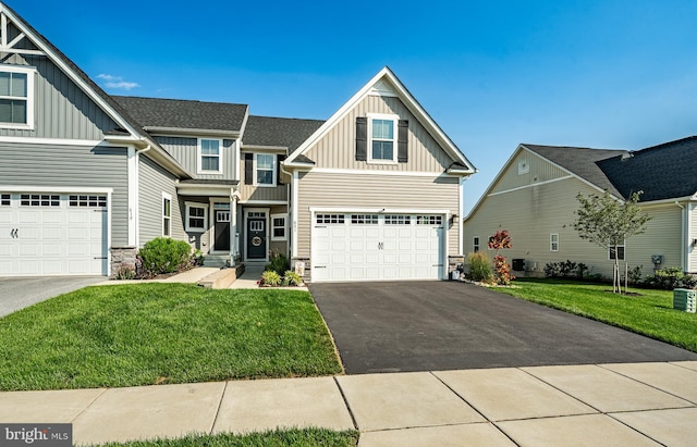 621 Thomas Penn Dr, West Grove, PA 19390 - craftsman house featuring board and batten siding, stone siding, driveway, and a front yard