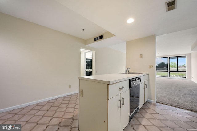 1967 Superfine Ln # 87, Wilmington, DE 19802 - kitchen featuring light countertops, light carpet, black dishwasher, recessed lighting, and white cabinets