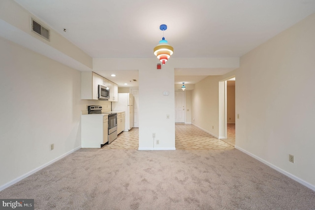 1967 Superfine Ln # 87, Wilmington, DE 19802 - unfurnished living room featuring light carpet and recessed lighting