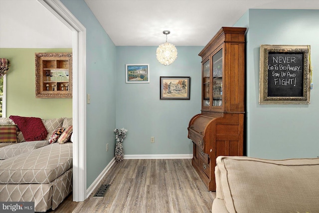 352 Ocean, Ocean Pines, MD 21811 - bedroom with wood finished floors and a chandelier