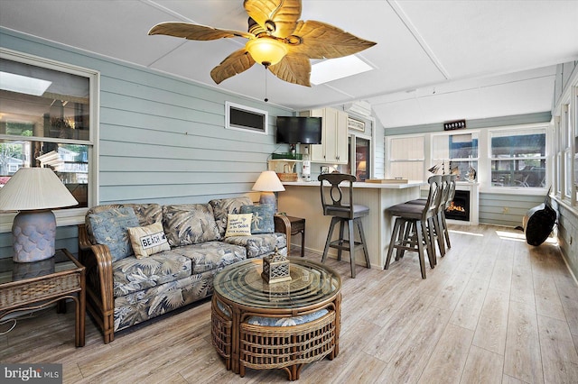 352 Ocean, Ocean Pines, MD 21811 - living room featuring a skylight, light wood finished floors, and a ceiling fan