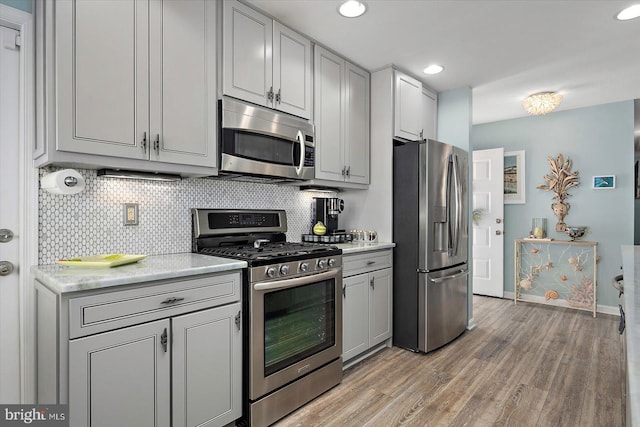 352 Ocean, Ocean Pines, MD 21811 - kitchen with stainless steel appliances, light wood-type flooring, tasteful backsplash, recessed lighting, and gray cabinetry