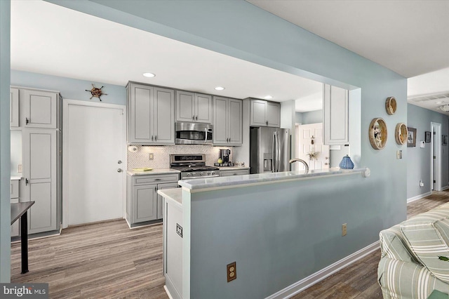 352 Ocean, Ocean Pines, MD 21811 - kitchen with stainless steel appliances, gray cabinets, light wood-style floors, light countertops, and recessed lighting