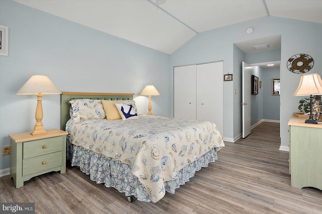 352 Ocean, Ocean Pines, MD 21811 - bedroom with wood finished floors, vaulted ceiling, and a closet