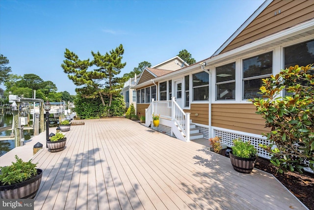 352 Ocean, Ocean Pines, MD 21811 - wooden deck featuring boat lift, a sunroom, and a dock