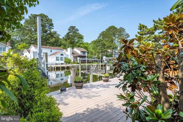 352 Ocean, Ocean Pines, MD 21811 - wooden deck with boat lift, a water view, and a dock