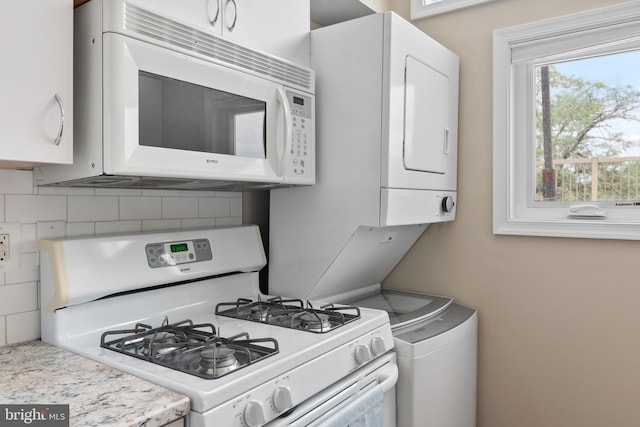 308 Forbes St Unit P, Annapolis, MD 21401 - kitchen featuring white appliances, white cabinetry, backsplash, and light countertops