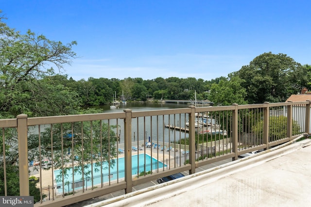 308 Forbes St Unit P, Annapolis, MD 21401 - balcony featuring a water view, view of pool area, and a forest view