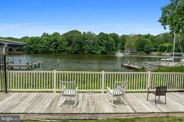 308 Forbes St Unit P, Annapolis, MD 21401 - wooden terrace with a water view, a dock, and a view of trees