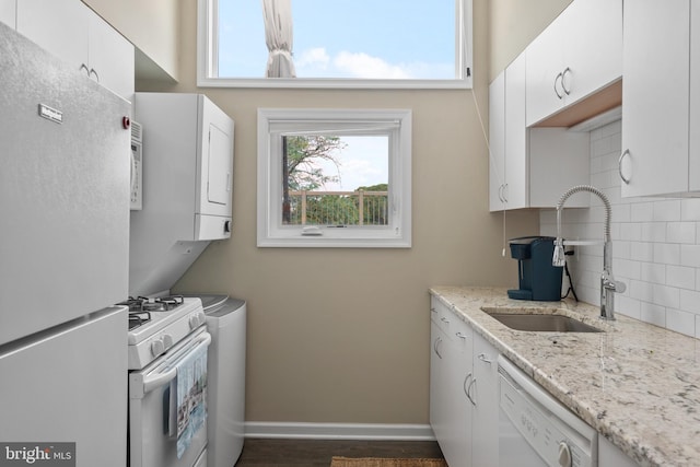 308 Forbes St Unit P, Annapolis, MD 21401 - kitchen with white appliances, decorative backsplash, white cabinetry, and light stone countertops