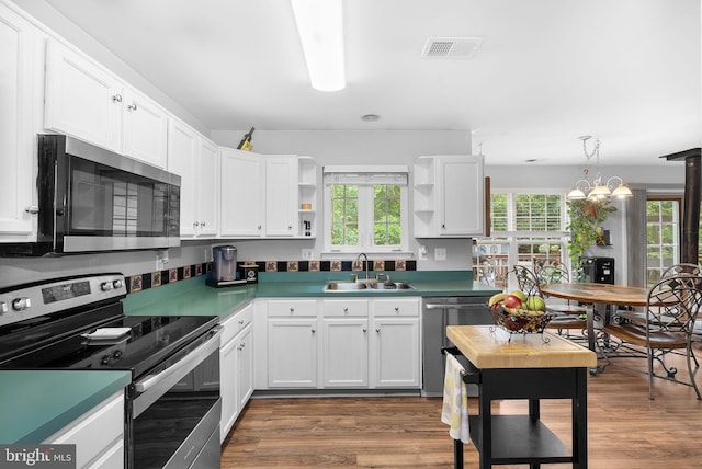 17391 Arrowood Pl, Round Hill, VA 20141 - kitchen featuring stainless steel appliances, open shelves, white cabinets, and dark wood finished floors