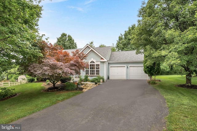 17391 Arrowood Pl, Round Hill, VA 20141 - obstructed view of property with an attached garage, driveway, a front lawn, and a shingled roof